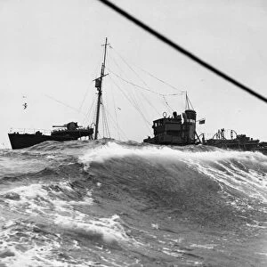 The British armed trawler KINGSTON AMBER battles through heavy seas near Scarpa Flow