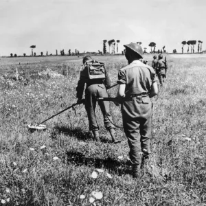 British army soldiers at work searching for enemy mines during the push in to France