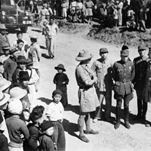 British and Chinese Officers meet on the road in Burma. Chinese reinforcements passing