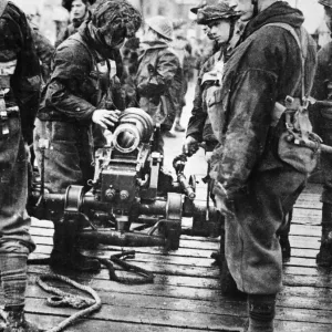 British commandos dismantle a mountain howitzer during Second World War British commandos dismantle a mountain howitzer during Second World War