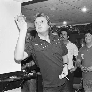 British dart player Eric Bristow pictured at the pubb, enjoying a friendly game with