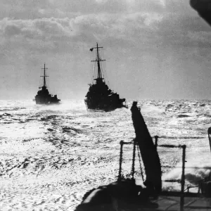 British destroyers at sea. Destroyers silhouetted against the skyline British destroyers at sea. Destroyers silhouetted against the skyline