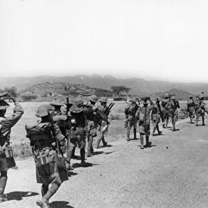British and Indian army soldiers on the frontline marching forwards towards t the Battle