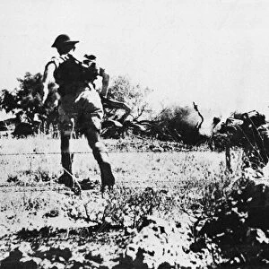 British infantry attack a German 88mm gun position in East Sicily. 6th August 1943