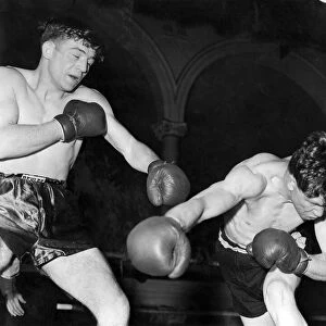 British middleweight boxer Johnny Sullivan catches Michael Stack with a left swing