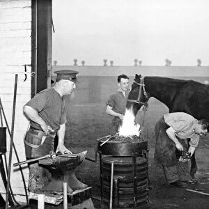 A British officer (right) is pictured at a stables in The Hull