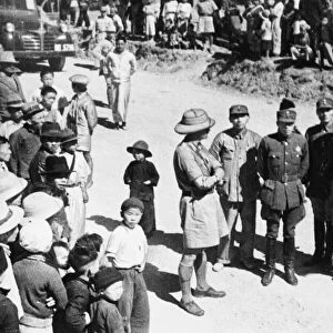 British officers meet with a Chinese Colonel and other officers of the Chinese forces