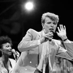 British pop singer David Bowie performing on stage during the Live Aid concert at Wembley