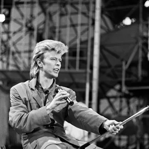 British pop singer David Bowie performing on stage at Wembley. 20th June 1987
