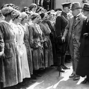 British Prime Minister David Lloyd George inspecting munitions workers during a visit to British Prime Minister David Lloyd George inspecting munitions workers during a visit to