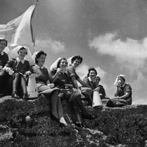 British Red Cross nurses who are administering to the wounded Allied soldiers barely one