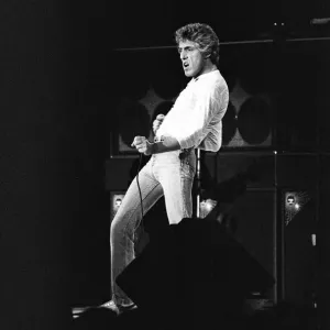 British rock group The Who, performing on stage at the NEC in Birmingham. Roger Daltrey