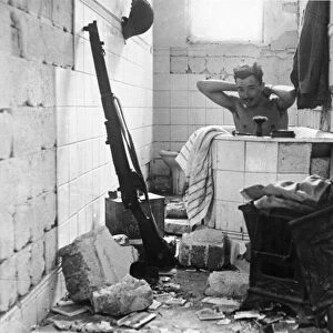 A British solder having a bath. Tobruk. Libya. The Siege of Tobruk lasted