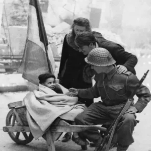 A British soldier of 3rd Division makes friends with a young French couple A British soldier of 3rd Division makes friends with a young French couple