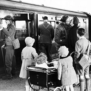 British soldier says goodbye to his family at English station