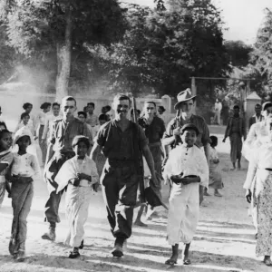 British soldiers and locals in the compound of the church in Chantha British soldiers and locals in the compound of the church in Chantha