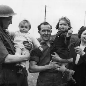 British soldiers making friends with French families in the Bayeux area of Normandy British soldiers making friends with French families in the Bayeux area of Normandy