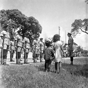 British soldiers marching in Georgetown, British Guiana watched by local citizens