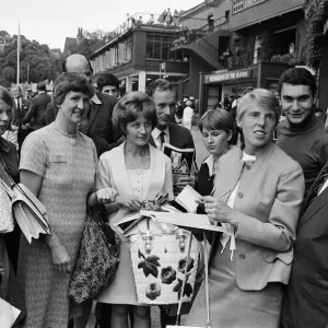 British Tennis player Ann Jones (3rd from right) signs autographs for her young fans