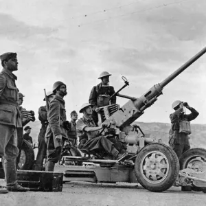 British troops at Crete. a gun on the look out for Italian raiders. December 4th 1940 British troops at Crete. a gun on the look out for Italian raiders. December 4th 1940