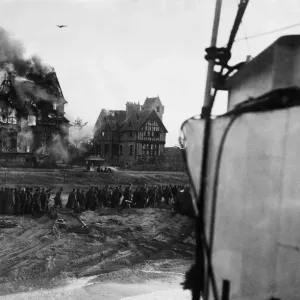 British troops under fire on beach at Juno, Normandy. Soon after zero hour German British troops under fire on beach at Juno, Normandy. Soon after zero hour German