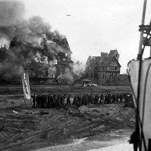 British troops under fire on Juno beach at Normandy shortly after the D-Day landings