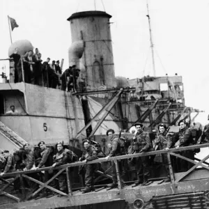 British troops on the gangway going aboard an L. S. I. 7th June 1944 British troops on the gangway going aboard an L. S. I. 7th June 1944