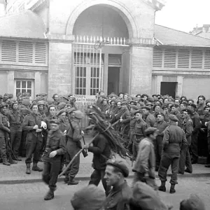 British troops outside the bath house in a Normandy town in Northern France shor British troops outside the bath house in a Normandy town in Northern France shor