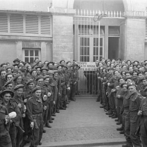 British troops outside the bath house in an unknown Normandy town in Northern France a
