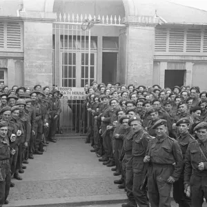 British troops outside the bath house in an unknown Normandy town in Northern France a British troops outside the bath house in an unknown Normandy town in Northern France a