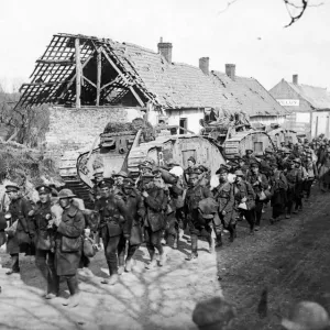 British troops passing tanks in a French village close to Amiens following the German British troops passing tanks in a French village close to Amiens following the German