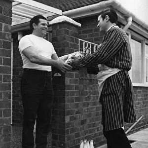 British wrestler Count Bartelli takes in the daily order of meat at his home near Crewe