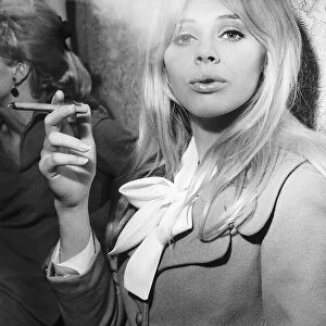 Britt Ekland Actress pictured enjoying the cigar at the Ideal Home Exhibition in London