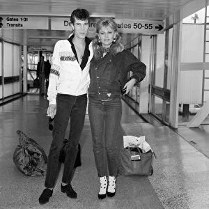 Britt Ekland with boyfriend Slim Jim McDonnell at Heathrow Airport after flying in