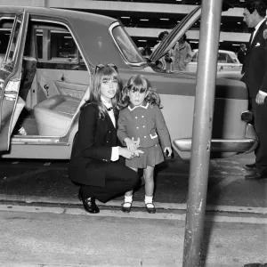 Britt Ekland Print at London Airport with Daughter