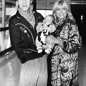 Britt Ekland with her toy boy Jim McDonnell and their baby for the openning of her film