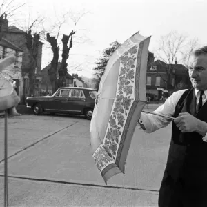 The Brolley Challenger - Jim Carver, of Orpington, taking an umbrella out of a case The Brolley Challenger - Jim Carver, of Orpington, taking an umbrella out of a case