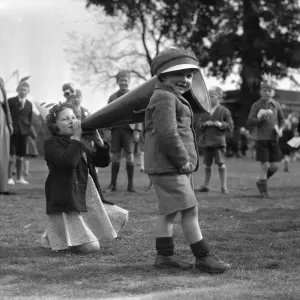 Brother and sister seen here playing with a giant megaphone at the Twickenham Garden Fete