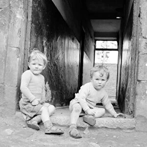 Two brothers seen here playing in a alley way of a tenement block in Govan, Glasgow