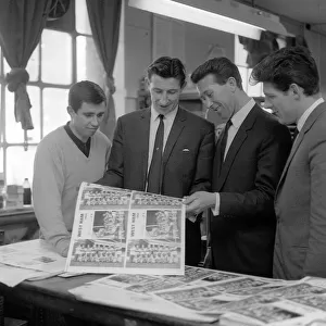 Bill Brown of Tottenham Hotspurs who runs a print company shows West Ham players Ron
