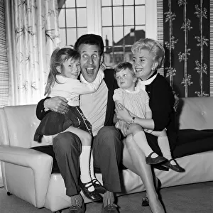Bruce Forsyth is pictured at home in Mill Hill with his wife Penny and daughters Debbie