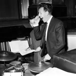 Bruce Forsyth at The Royal Variety show rehearsal, playing the drums which are part of Bruce Forsyth at The Royal Variety show rehearsal, playing the drums which are part of