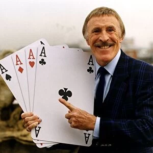 Bruce Forsyth TV Presenter Holding playing cards which are used on his hit tv show Play