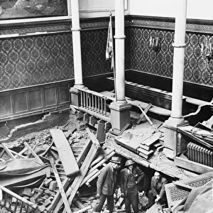 BUCKINGHAM PALACE BOMBS. Officials of the Palace looking at the wrecked