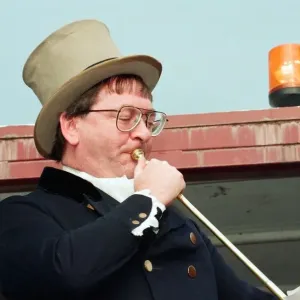 Buglar Ian Dewar at the full blast during the annual Riding the Fair procession sets off