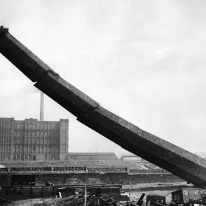 Built nearly a century ago, this derelict mill chimney crashed to earth today