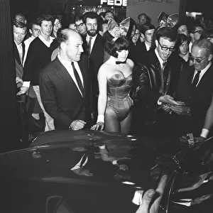 Bunny girls and Peter Seller seen here at the British International Motor Show in London
