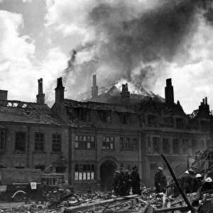 A burning warehouse backing on the River Hull, set alight by delayed action bombs during