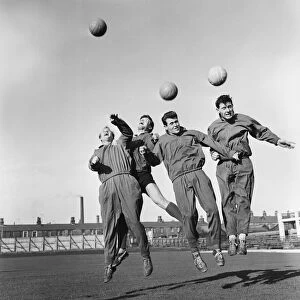 Burnley players jumping for the ball - from left to right