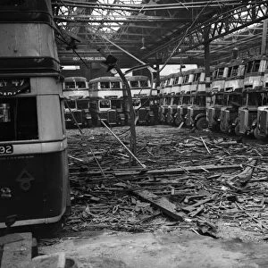 Burnt out buses and debris strewn across the floor of the Highgate Road Bus Garage